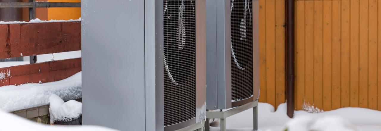 external heat pumps covered in snow